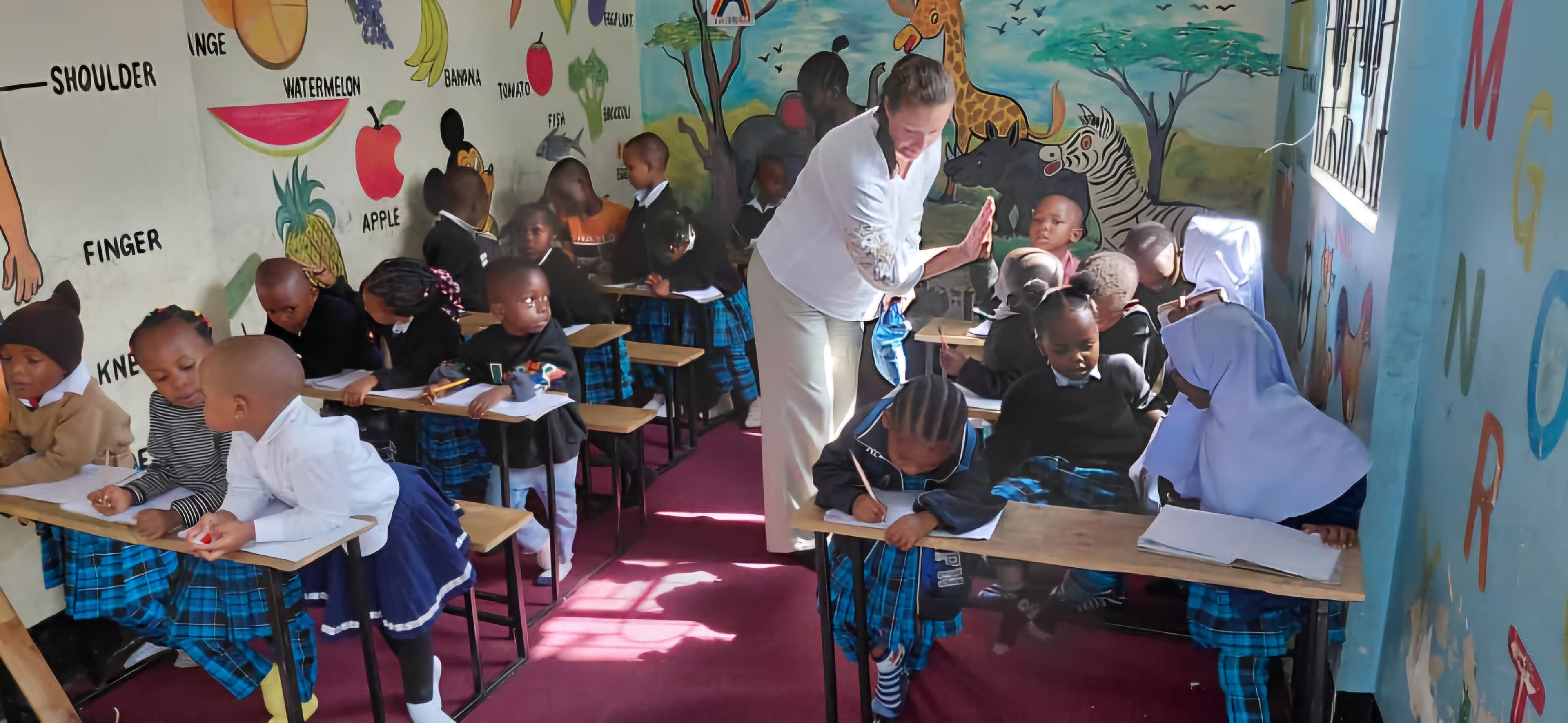 Children smiling in the Rose Flower Daycare classroom
