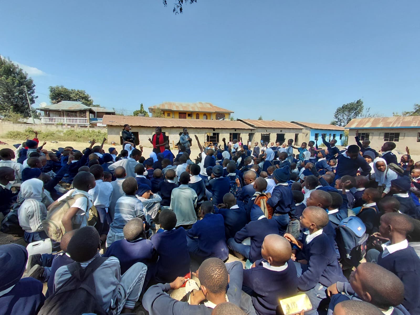 Teacher leading children in an outdoor story circle